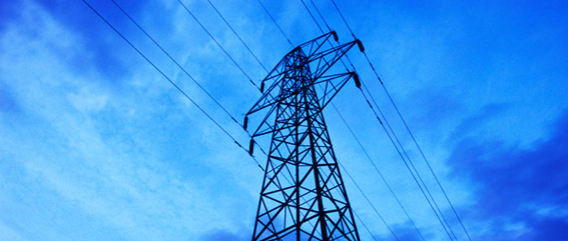 Electricity pylon against a blue sky.