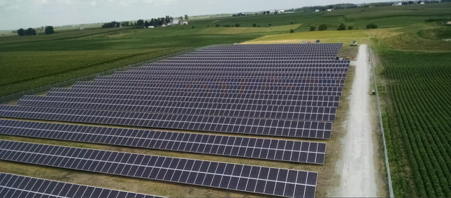 Solar panels in a large open field.