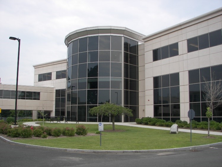 Modern office building with glass facade.