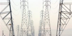 Power lines and transmission towers at sunset.